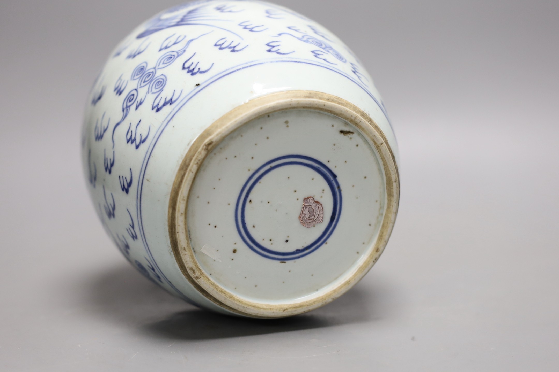 An 18th century Chinese provincial blue and white dragon and phoenix jar, 20cm high